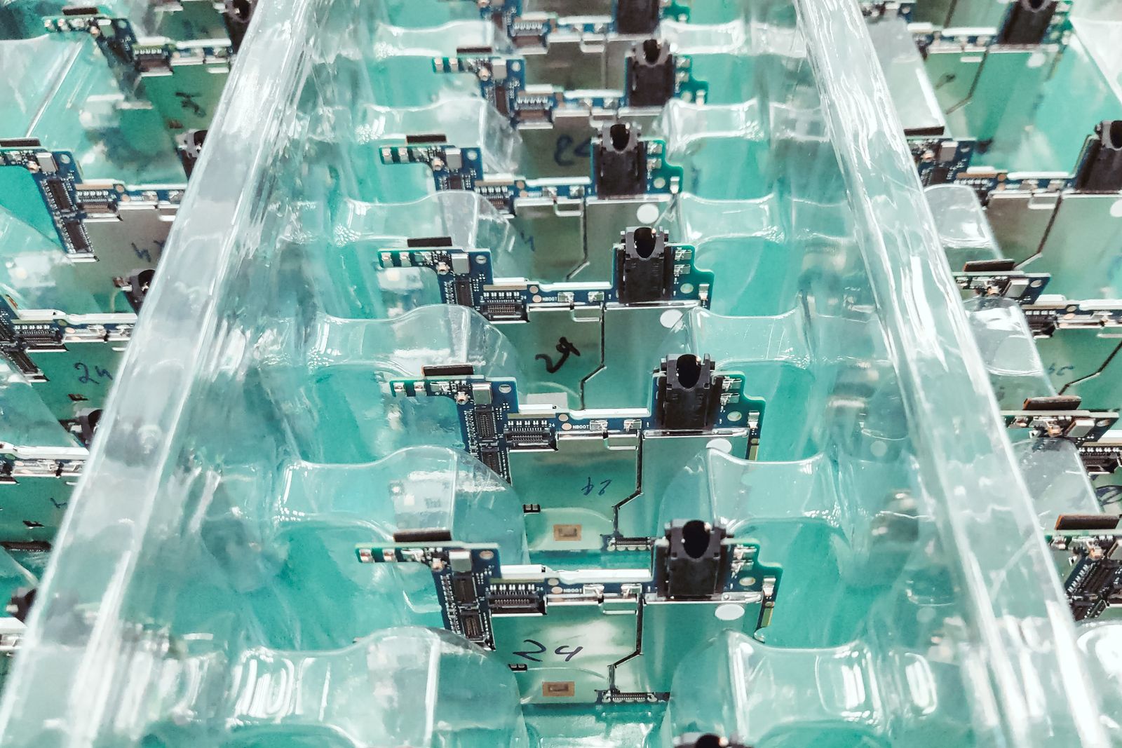 Rows of printed circuit boards in electronics production