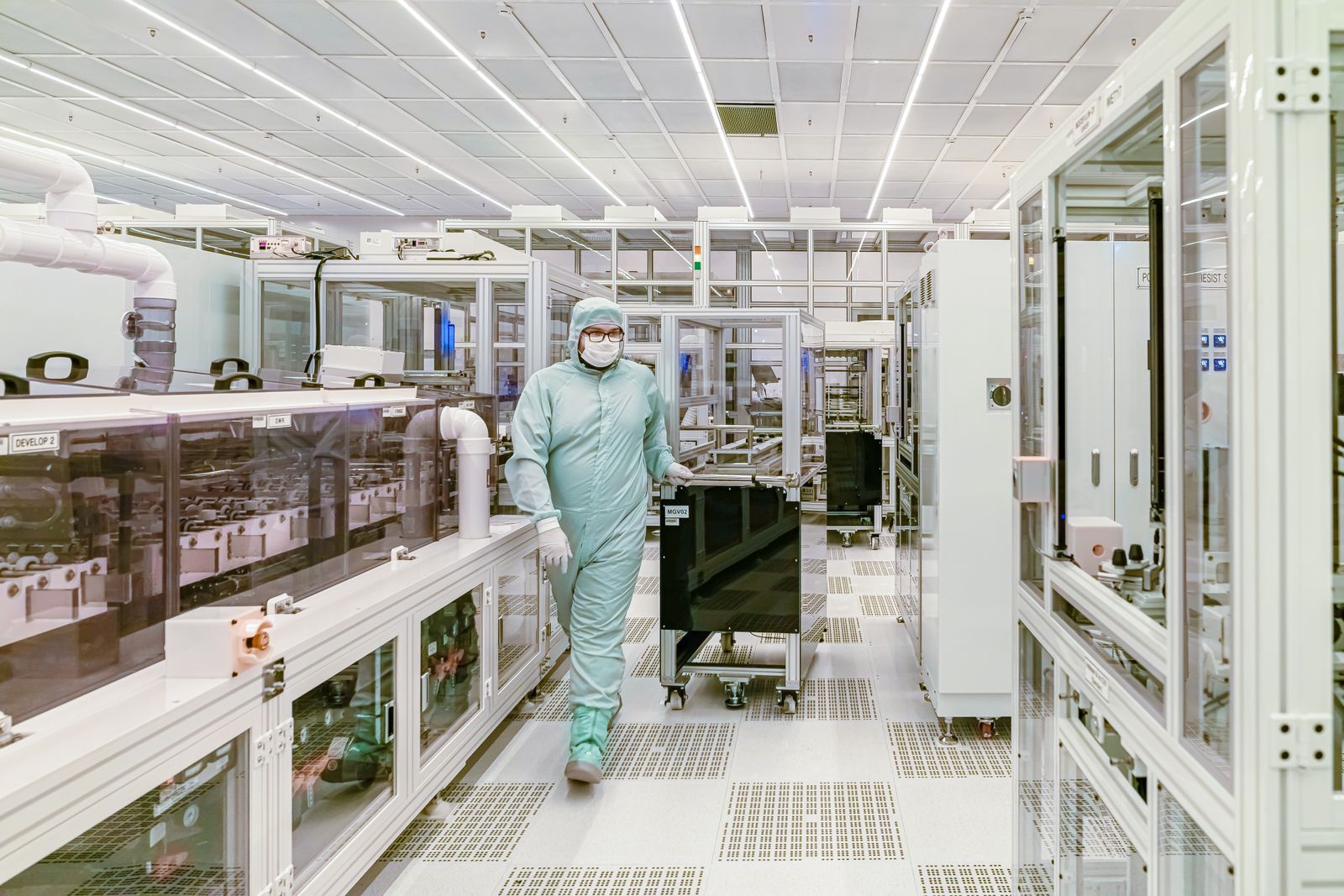 Technician working in a semiconductor fabrication cleanroom
